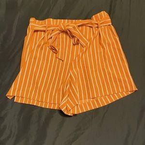 Mustard yellow and white striped shorts